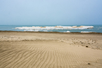 floating ice and sand dune