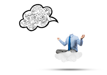 Headless businessman meditating