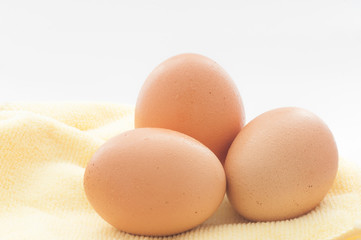 Three eggs on white background.