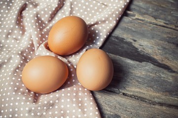Chicken egg on old wooden background