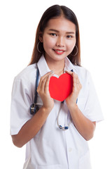 Asian young female doctor hold a red heart and smile.