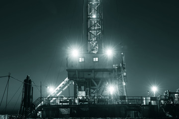 The oil derrick is homework, in the evening