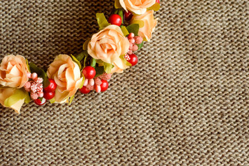 a wreath of flowers on textile background