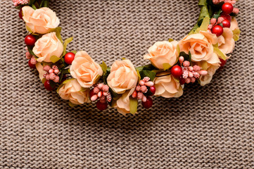 a wreath of flowers on textile background