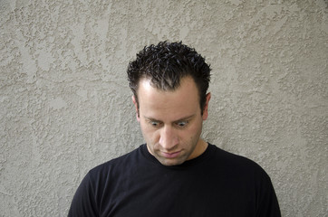 Are you down? Man looking down with eyes wide open.