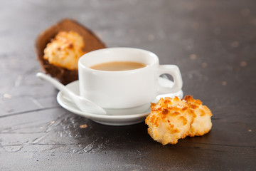 coffee and coconut cookies on a table, selective focus, copy space