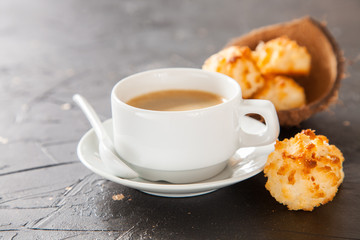 coffee and coconut cookies on a table, selective focus, copy space