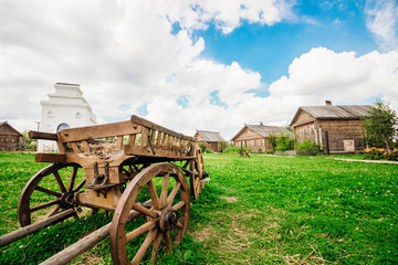 Wooden carts of the countryside on a background of sky and cloud