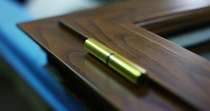 macro of a window frame,a door, window or blinds,with the details on the handles or on its hinges,the frame can be wood,aluminum,with thermal insulation.Concept:construction,energy conservation,design