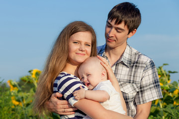 Happy family playing in park at the day time.