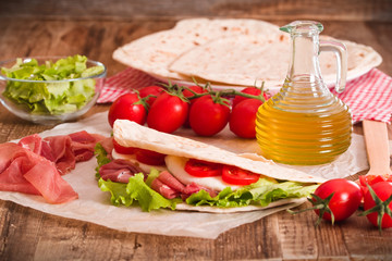 Piadina with ham and lettuce. 