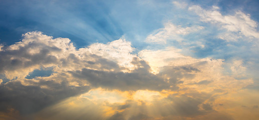 Sunlight shining through the clouds.