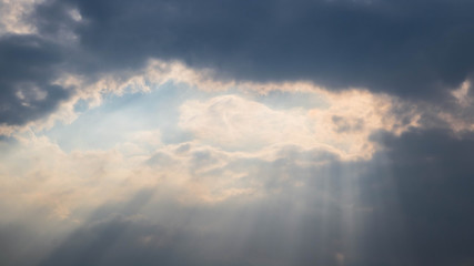 Fototapeta na wymiar Sunlight shining through the clouds.