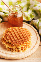 Waffles and glass with honey
