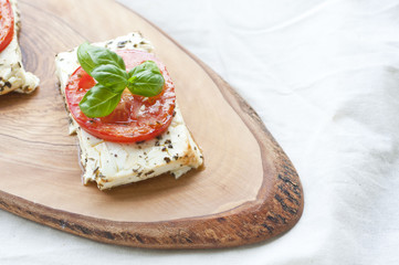 Roasted feta with tomatoes