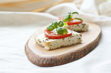 Roasted feta with tomatoes