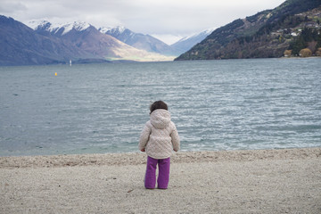 Child looking out to sea - 133174964