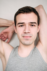 Fototapeta premium Close up portrait of a handsome young man on white