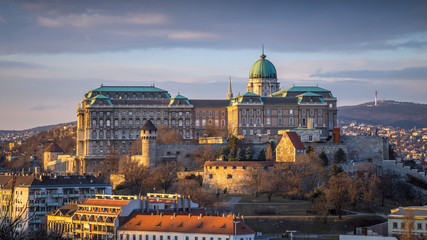 Fototapeta na wymiar Budapest, Hungary - The famous Buda Castle (Royal Palace), St. Matthias Church and Fishermen's Bastion at sunset on a nice winter afternoon taken from Gellert Hill