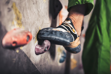 male foot on climbing wall - obrazy, fototapety, plakaty
