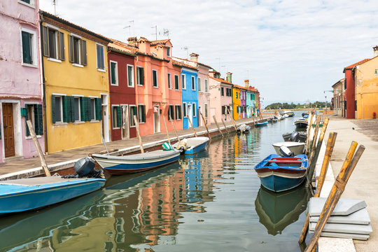 Colorful houses lining the canal (Burano, Italy)