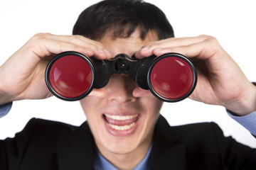 asian businessman with binoculars