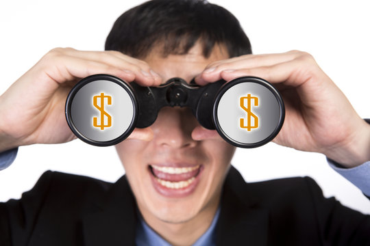 asian businessman with binoculars