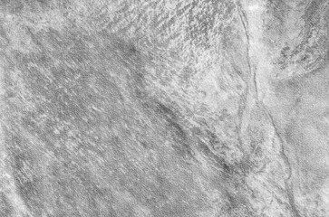 Closeup surface at stone pattern at stone brick wall in the garden textured background in black and white tone