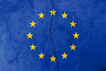 A crack in the wall. EU flag in the background