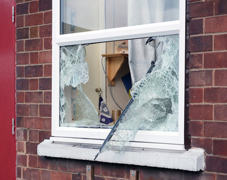 Broken window caused by burglar breaking in to premisis to steal.