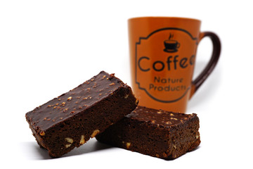 Almond chocolate brownie with coffee cup on white background