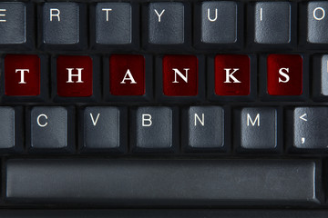 Word of Thanks on the computer keyboard.