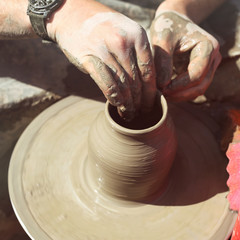 Dirty hands of potter