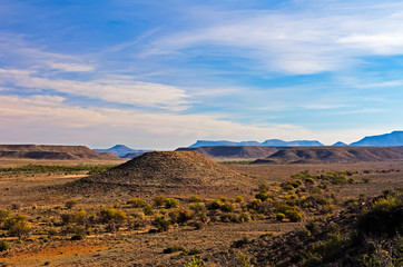 Naklejka premium Karoo Landscape with Round Flat-topped Hill and Blue Sky
