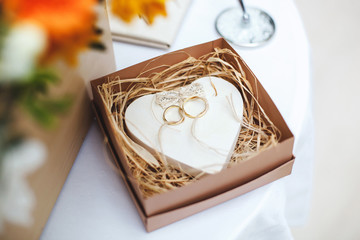 Beautiful wedding rings on the wedding ceremony. A box for rings