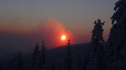 Fototapeta premium Colorful landscape at the winter sunrise in the mountain forest. Winter view from Jested