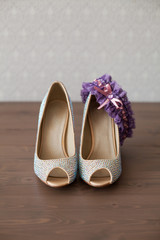 Obraz na płótnie Canvas Elegant wedding shoes with colored rhinestones