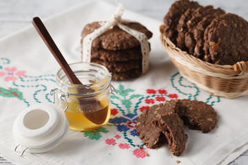 Healthy oat cookies with honey on table