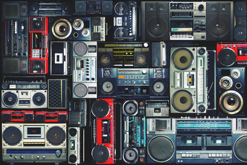 Vintage wall full of radio boombox of the 80s - Powered by Adobe