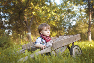 Little boy walking in the garden