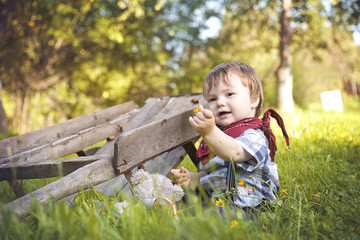 Little boy walking in the garden