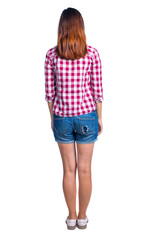 back view of standing young beautiful  woman.  girl  watching. Rear view people collection.  backside view of person. Girl in shorts and a plaid shirt, looking ahead.