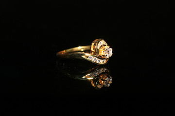 Jewellery diamond ring and gemstone on a black background