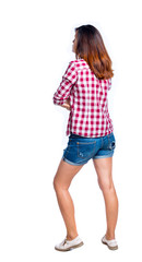 back view of standing young beautiful  woman.  girl  watching. Rear view people collection.  backside view of person. Girl in shorts and a plaid shirt, crossed her arms over her stomach.