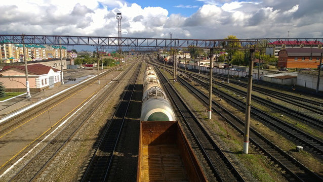 Freight train moving slowly on the station. The view from the top