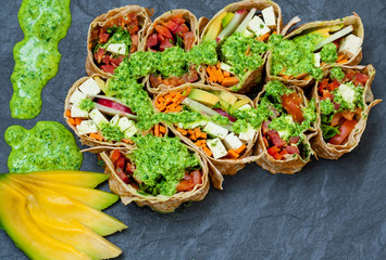 Healthy  vegan salad tortilla rolls with tofu and vegetables. Love for a healthy raw food concept.