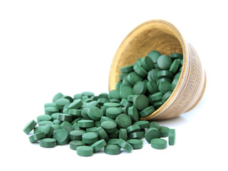 spirulina in a bowl on a white background