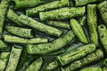 Fresh frozen green french bean with hoarfrost closeup as background. Healthy vitamin food.