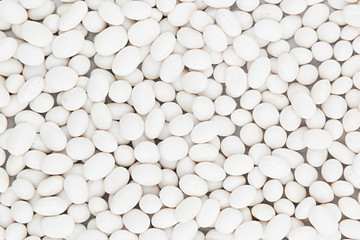 White kidney beans closeup top view background. Healthy protein food.