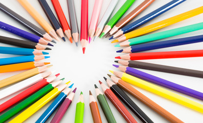 colored pencils lying around the heart